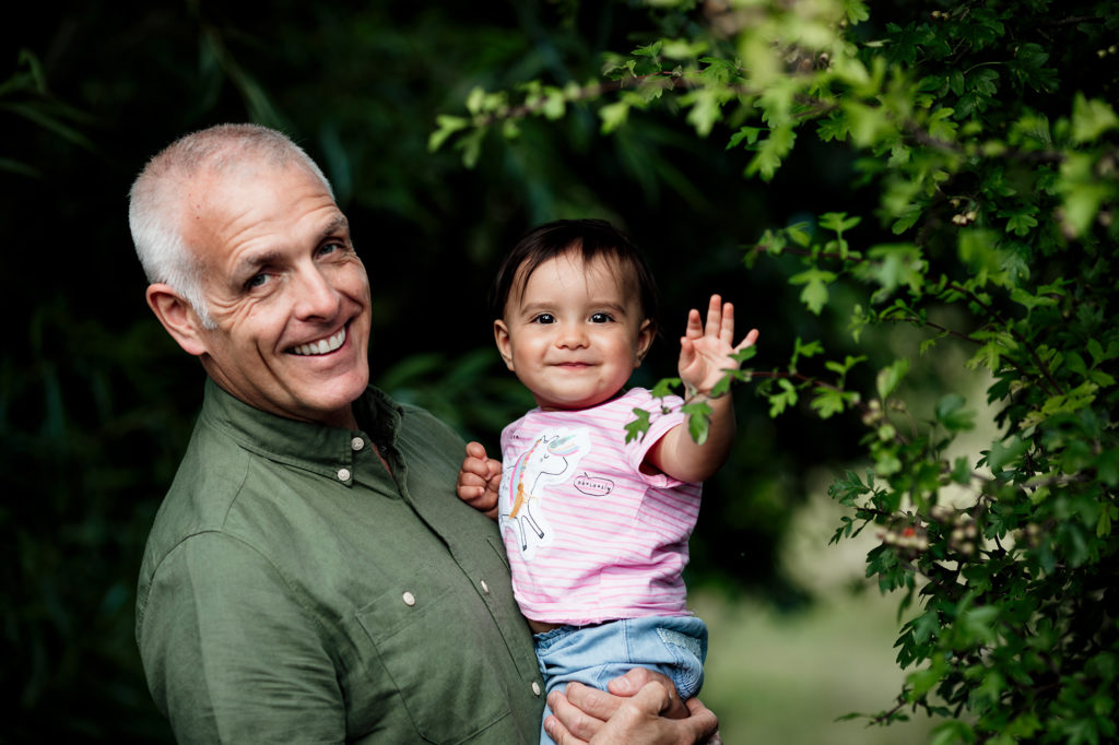 father and daughter smiling during photoshoot in surrey s