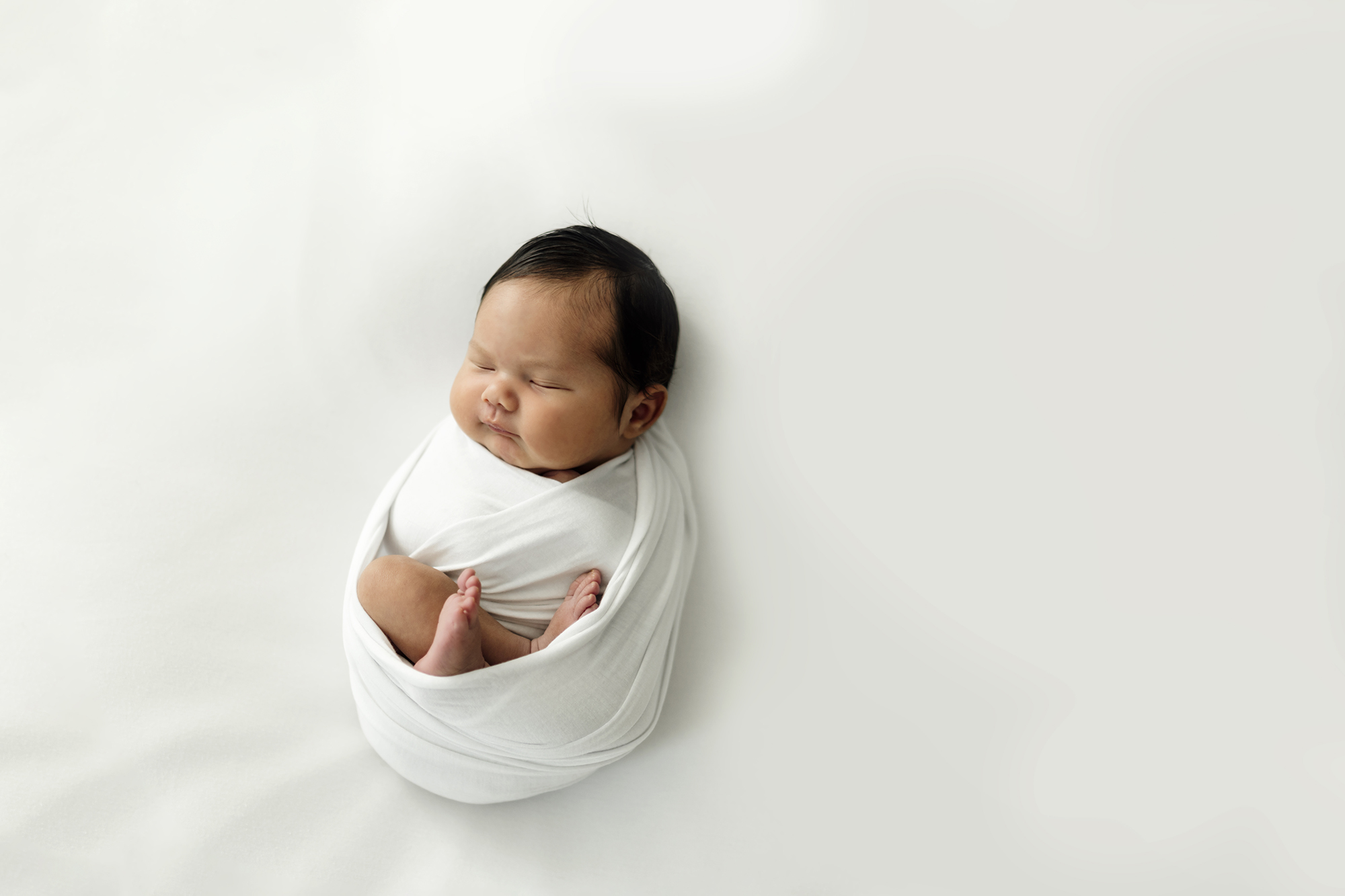 mother and newborn baby in photoshoot 