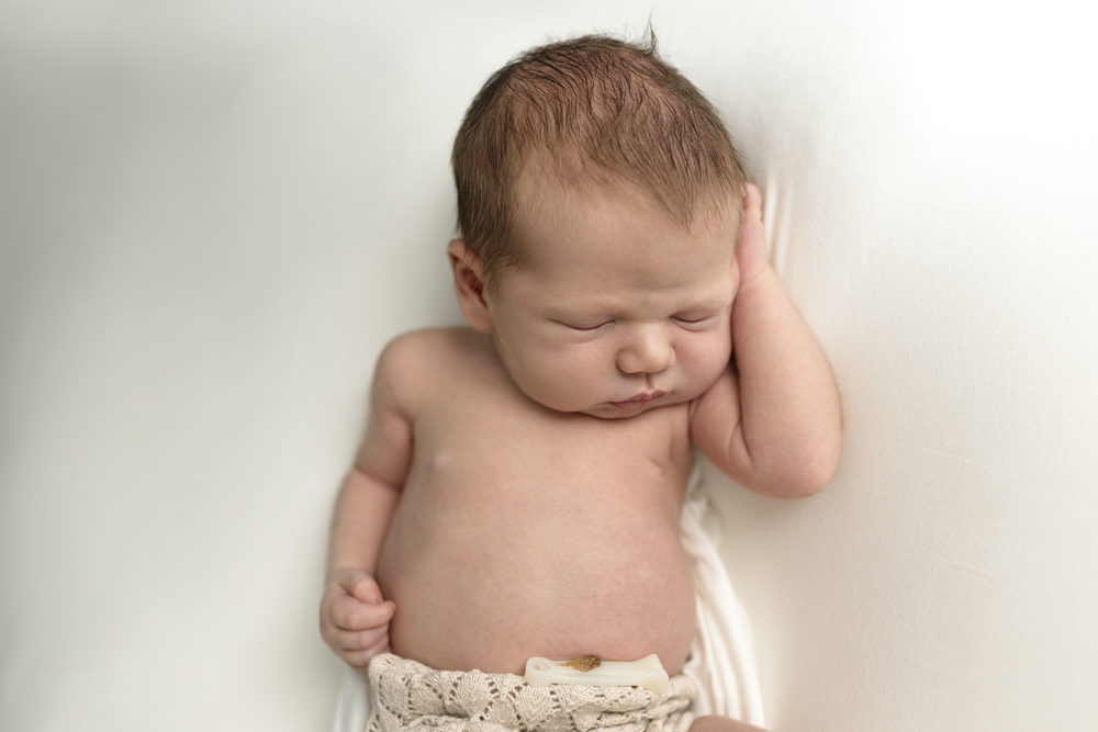 Naturally posed sleeping newborn baby 